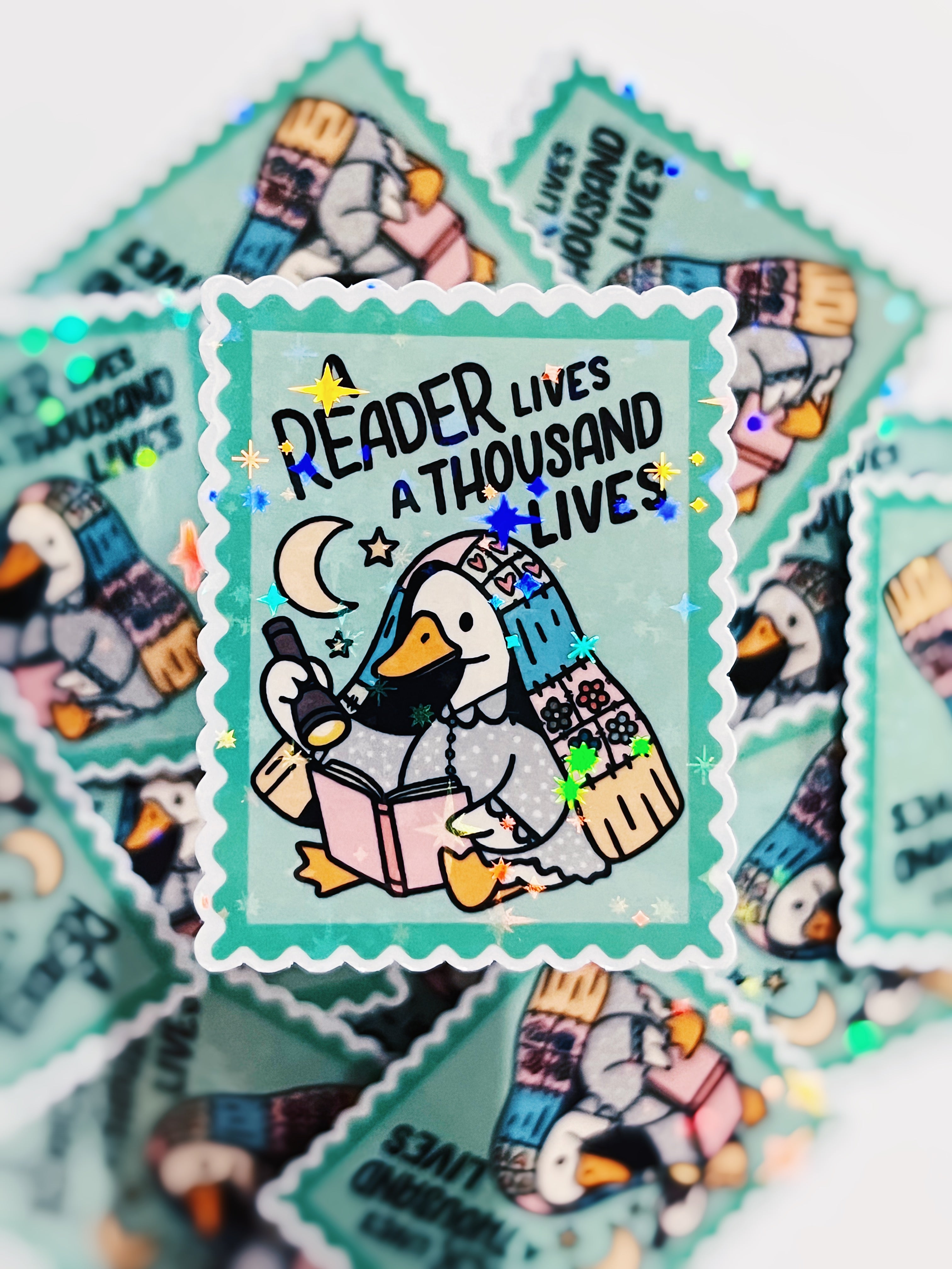 A Reader Lives a Thousand Lives Goose - Holographic Vinyl Sticker